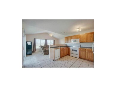 Open kitchen with tile flooring and a convenient p