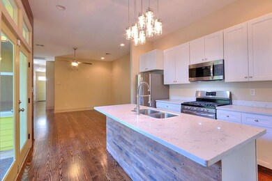 Nice Kitchen overlooking side porch and yard. SS a