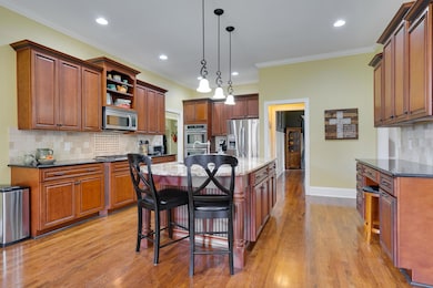 Original owners Installed additional cabinets over the desk in kitchen.