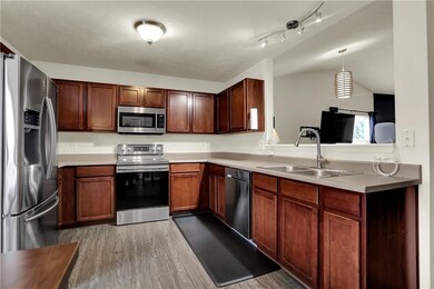 The bright kitchen has a surplus of storage and function