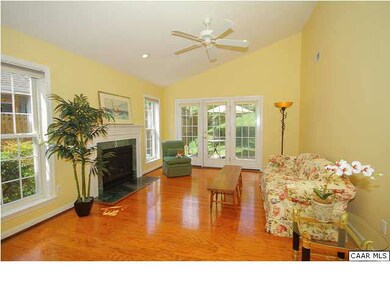 Living room also has a vaulted ceiling and        