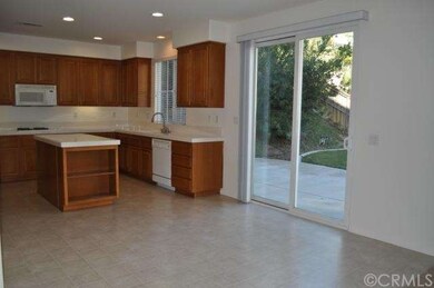 Breakfast nook area with tile flooring and slider 