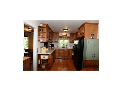 Kitchen with sparkling hardwood floor, updated cab