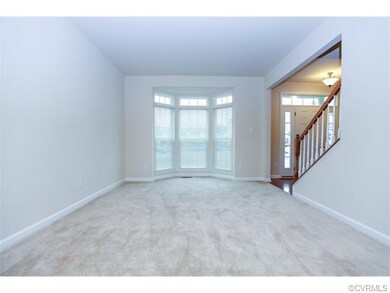 Formal living room with walkout bay window.