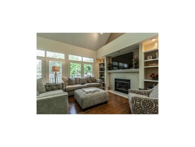 The great room showcases a wall of windows with a 