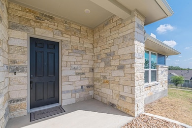 Property entrance with stone siding