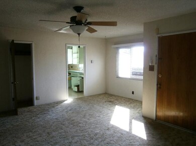 Living room looking into Kitchen Remote Control Ce
