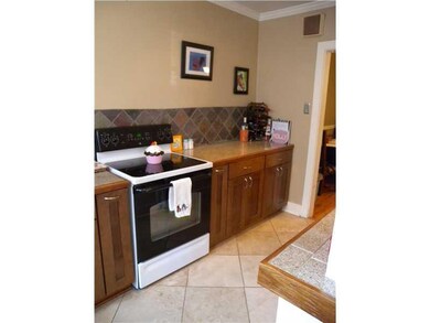 Kitchen. CERAMIC TILE COUNTER SPACE WITH TILE BACK