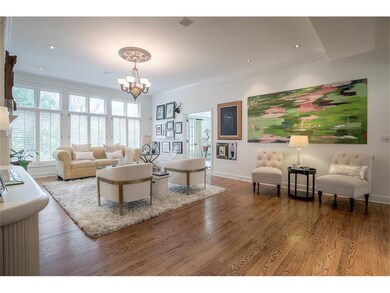 Large living room with plantation shutters, firepl