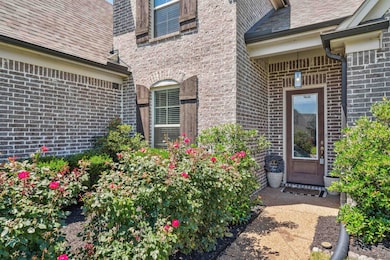 Entrance to property with brick siding