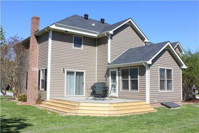 The Back of the home with the new wrap around deck for easy entertaining.