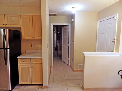 towards laundry front door and fridge 30