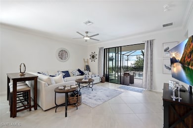 Living area with ceiling fan, ornamental molding,