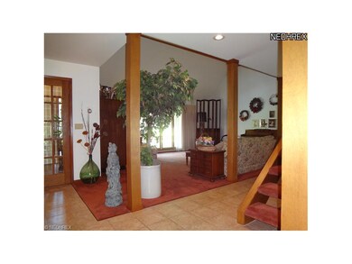 The formal living room is spacious and bright. The