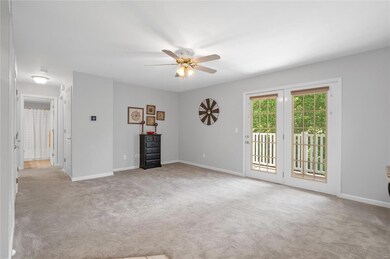 Living room opens to the private deck overlooking 