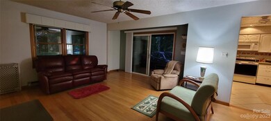 Family Room/Dining area with wood floors - Kitchen with tile floors