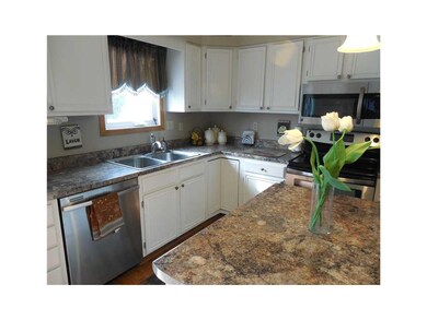 Kitchen. Freshly painted cabinets and hardware. On