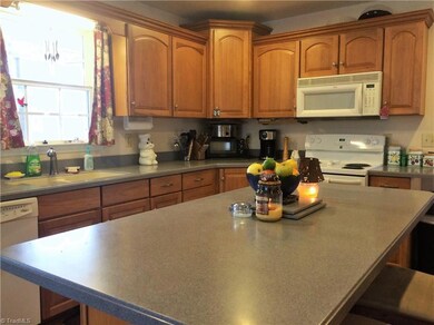 Kitchen has lots of cabinets storage space.