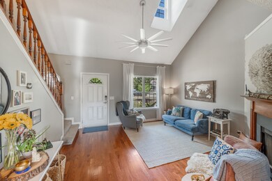 Abundant natural light and open stairway create an inviting space in great room and throughout this home.