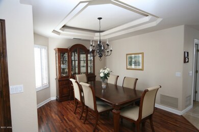 Formal Dining With Rosewood Floors