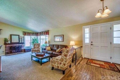 VIEW OF LIVING ROOM WITH FIREPLACE. 