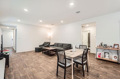 Dining space featuring wood finished floors, rece