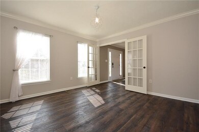 To the right of the front door is the study, priva