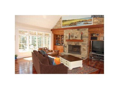 Family room with massive stone fireplace and built