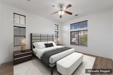 Bedroom featuring baseboards, visible vents, and 