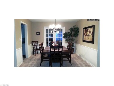 Upon entering the dining room, notice chair railin