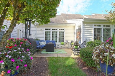 Rear view of property with an outdoor living space