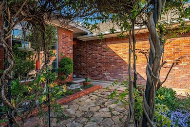 View of property exterior with brick siding