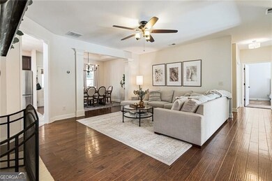 Light and airy great room with pristine hardwood f