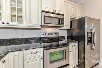 Updated cabinets and SS appliances, kitchen fridge remains