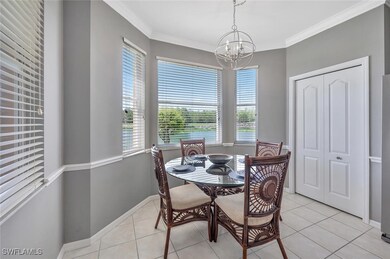 Dining area with a chandelier, healthy amount of n
