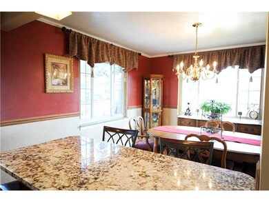 Kitchen. Eat in counter top that is open to the di