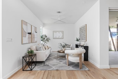 Living area with wood finished floors, healthy am