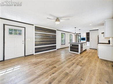 Open Concept Area – Seamless flow from the living room to the kitchen, with stylish lighting, neutral finishes, and plenty of room for dining and entertaining.