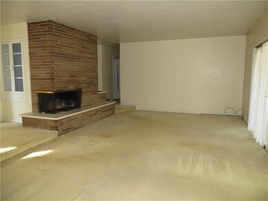 Living Room with Cozy Corner Log Burning Fireplace