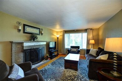 Cozy living room with hardwood floors, picture win