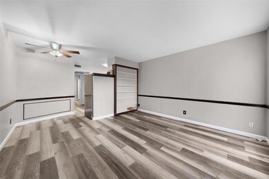 Empty room with light hardwood / wood-style floors
