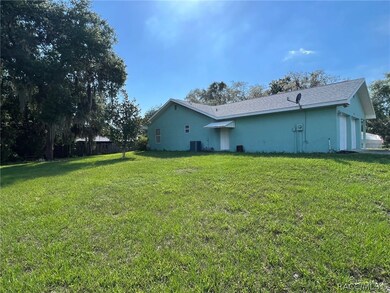 On half acre to the left of house is included