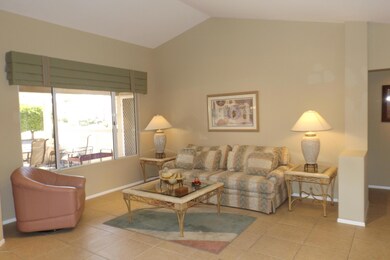 LIVING ROOM HAS VAULTED CEILING AND IS ADJACENT TO DINING ROOM AREA.