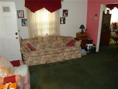 Large living room with ample natural light.