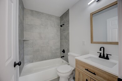 Full bathroom featuring tiled shower / bath combo,