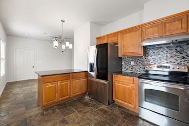 The large kitchen features a brand new refrigerato