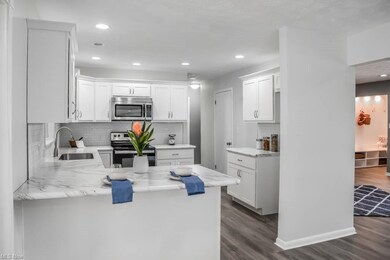 The kitchen has stainless steel appliances and sub