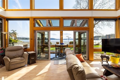 Living room slider opens to sun-room and the great outdoors... Windows equipped with great coverings...