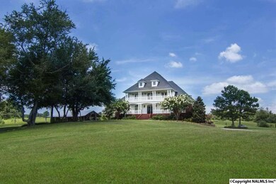 VIEW OF THIS SPECTACULATE HOME AS YOU ENTER THE ESTATE.