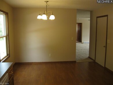 Nice open dinette area with laminate floor.